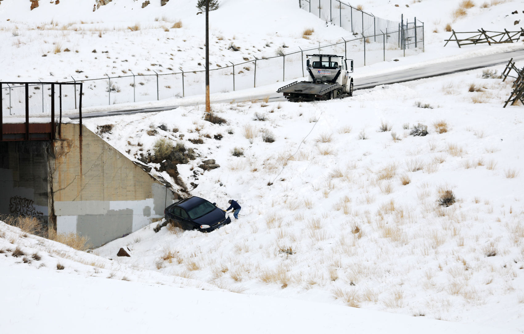 Car slips off icy street on Butte Hill